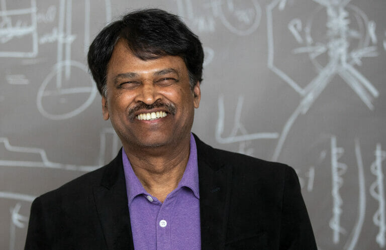 picture of Srinivansan Damodaran in front of chalkboard