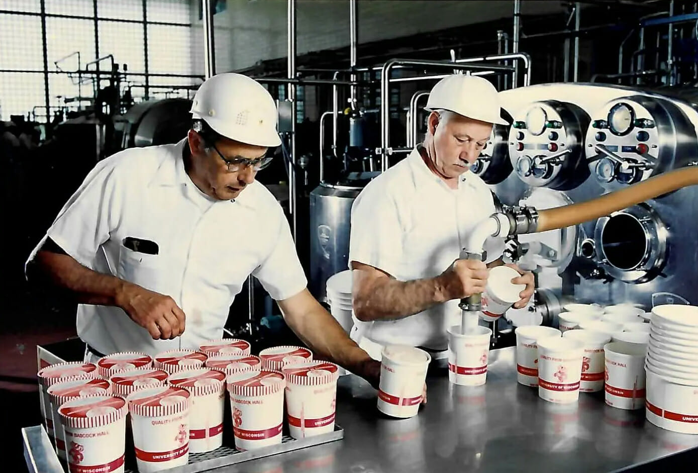 two men filling ice cream containers