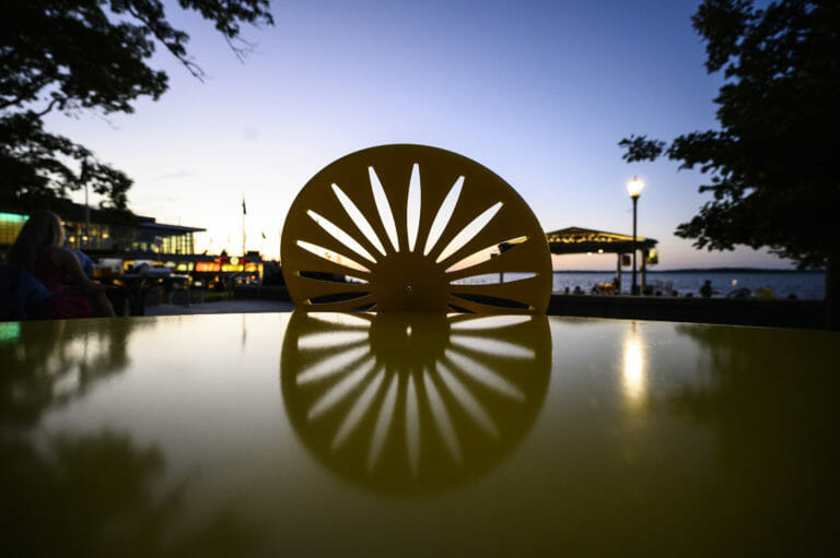 table with sunburst-designed chair is pictured